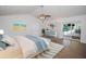 Bright bedroom with sliding glass doors to the pool and modern furnishings at 1021 Estremadura Dr, Bradenton, FL 34209