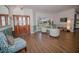 Inviting entryway with wood floors, decorative door, window seating, and stylish chairs at 1021 Estremadura Dr, Bradenton, FL 34209