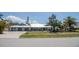 Single-Gathering home with a manicured lawn, two-car garage, and an inviting facade at 1021 Estremadura Dr, Bradenton, FL 34209