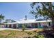 Charming single-Gathering home with a pristine lawn, two-car garage, and ample curb appeal at 1021 Estremadura Dr, Bradenton, FL 34209
