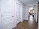 Hallway with multiple doors leading to various rooms, offering a glimpse into the home's layout and design at 1021 Estremadura Dr, Bradenton, FL 34209