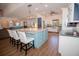 Eat-in kitchen boasts a large center island with barstool seating and modern appliances at 1021 Estremadura Dr, Bradenton, FL 34209