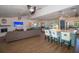 Open-concept living room flows into the kitchen, featuring a center island, and comfortable seating at 1021 Estremadura Dr, Bradenton, FL 34209