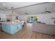 Spacious living area with kitchen, fireplace, and view of pool and backyard at 1021 Estremadura Dr, Bradenton, FL 34209