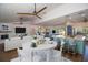 Bright, open living room with vaulted ceilings flows into the modern kitchen, perfect for entertaining at 1021 Estremadura Dr, Bradenton, FL 34209