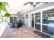 Covered patio offers dining and lounging space with views of the pool at 1021 Estremadura Dr, Bradenton, FL 34209