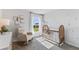 Cozy Bedroom with a crib, glider chair, soft rug, and a view to the outside at 10836 Gentle Current Way, Parrish, FL 34219