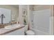 Clean bathroom featuring a shower-tub combination, white vanity, and neutral tones at 10841 Gentle Current Way, Parrish, FL 34219