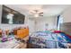 Bedroom featuring a TV, ceiling fan, and a large bed at 10944 Rainbow Pyrite Dr, Wimauma, FL 33598
