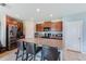 Spacious kitchen with a granite island, seating, and stainless steel appliances at 10944 Rainbow Pyrite Dr, Wimauma, FL 33598