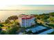 Aerial view showcasing the property's waterfront location and lush surroundings at 1100 Imperial Dr # 403, Sarasota, FL 34236