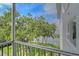 Screened balcony offering stunning waterfront and lush greenery views at 1100 Imperial Dr # 403, Sarasota, FL 34236