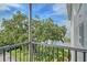 Screened balcony offering stunning waterfront and lush greenery views at 1100 Imperial Dr # 403, Sarasota, FL 34236