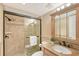 Well-appointed bathroom with tiled shower, granite countertop, and modern vanity at 1100 Imperial Dr # 403, Sarasota, FL 34236