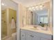 Clean bathroom featuring a shower, toilet, single sink vanity, and neutral finishes at 1100 Imperial Dr # 403, Sarasota, FL 34236