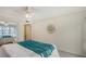 Cozy bedroom featuring a mirrored closet door and relaxing decor at 1100 Imperial Dr # 403, Sarasota, FL 34236