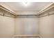 Walk-in closet with built-in shelving and ample storage space at 1100 Imperial Dr # 403, Sarasota, FL 34236