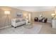 Cozy living room features neutral walls, comfortable seating, and a stylish rug over tiled floor at 1100 Imperial Dr # 403, Sarasota, FL 34236
