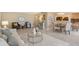 Inviting open-concept living and dining area with tile floors, neutral tones, and comfortable seating at 1100 Imperial Dr # 403, Sarasota, FL 34236