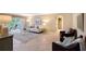 Bright living room with tile flooring, access to a balcony, neutral paint, and comfortable furnishings at 1100 Imperial Dr # 403, Sarasota, FL 34236