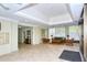 Well-lit lobby featuring neutral tile flooring, comfortable seating, and classic architectural details at 1100 Imperial Dr # 403, Sarasota, FL 34236