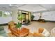 Inviting lobby area with comfortable seating, tile floors, and expansive windows letting in ample natural light at 1100 Imperial Dr # 403, Sarasota, FL 34236