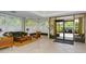 Spacious lobby with comfortable seating, plantation shutters for natural light, and easy access through glass doors at 1100 Imperial Dr # 403, Sarasota, FL 34236