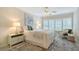 Serene main bedroom with soft natural light, plush bedding, and stylish decor at 1100 Imperial Dr # 403, Sarasota, FL 34236
