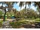 Outdoor playground in the park features a shady area for to play and picnic tables at 1100 Imperial Dr # 403, Sarasota, FL 34236