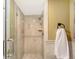Tiled walk-in shower with glass door and modern fixtures at 1100 Imperial Dr # 403, Sarasota, FL 34236