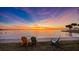 Breathtaking sunset view over the bay, with colorful skies and comfortable seating along the waterfront at 1100 Imperial Dr # 403, Sarasota, FL 34236