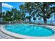 Community pool area overlooking the bay, perfect for relaxation and enjoyment of scenic waterfront views at 1100 Imperial Dr # 403, Sarasota, FL 34236