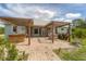 Rear patio area with covered outdoor kitchen and open seating at 1108 64Th Street E Ct, Bradenton, FL 34208