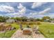 Inviting backyard oasis featuring a serene pond, and a brick fire pit area, perfect for outdoor entertaining at 1108 64Th Street E Ct, Bradenton, FL 34208
