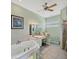 Relaxing bathroom with a jetted tub, vanity area, and separate glass enclosed shower at 1108 64Th Street E Ct, Bradenton, FL 34208