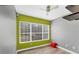 The spare bedroom has a large window for light, with neutral walls, and grey laminate flooring at 1108 64Th Street E Ct, Bradenton, FL 34208