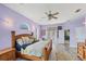 Spacious bedroom features a ceiling fan, hardwood floors, and an abundance of natural light at 1108 64Th Street E Ct, Bradenton, FL 34208