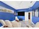 Bright bonus room boasts four recliners, a large screen TV, and is an inviting space for entertainment and relaxation at 1108 64Th Street E Ct, Bradenton, FL 34208