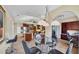 Open-concept dining area features modern lighting, adjacent kitchen, and a built-in workstation at 1108 64Th Street E Ct, Bradenton, FL 34208