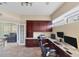 Well-lit home office with custom built-ins and desk space for two, with a view to the living room at 1108 64Th Street E Ct, Bradenton, FL 34208