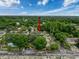 Aerial view of townhomes in lush green neighborhood with mature trees and landscaping at 11717 Wesson E Cir, Tampa, FL 33618