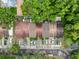 Aerial view of townhome rooftops with parking and mature surrounding trees at 11717 Wesson E Cir, Tampa, FL 33618