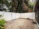 Fenced backyard featuring a tiled patio and well-maintained landscaping for relaxation and privacy at 11717 Wesson E Cir, Tampa, FL 33618