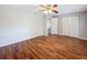 Large bedroom with hardwood floors, a ceiling fan, and ample closet space at 11717 Wesson E Cir, Tampa, FL 33618