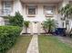 Charming front entrance with a welcoming walkway and well-maintained landscaping and decorative shutters at 11717 Wesson E Cir, Tampa, FL 33618