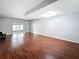 Spacious living room with hardwood floors, offering lots of space and ample natural light at 11717 Wesson E Cir, Tampa, FL 33618