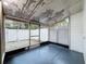 Enclosed patio area featuring a painted floor and a view of the fenced backyard at 11717 Wesson E Cir, Tampa, FL 33618