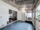 Enclosed patio with a sliding glass door to the outside and access to an outdoor AC unit at 11717 Wesson E Cir, Tampa, FL 33618