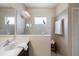 Modern bathroom featuring a glass shower and neutral colored tile work at 12116 Stuart Dr, Venice, FL 34293