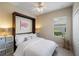 Cozy bedroom with a Murphy bed, a window, and cube storage at 12116 Stuart Dr, Venice, FL 34293